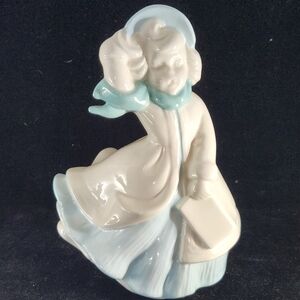 Vintage Ceramic Blue and White Glazed Ceramic Lady Christmas Caroler Figurine